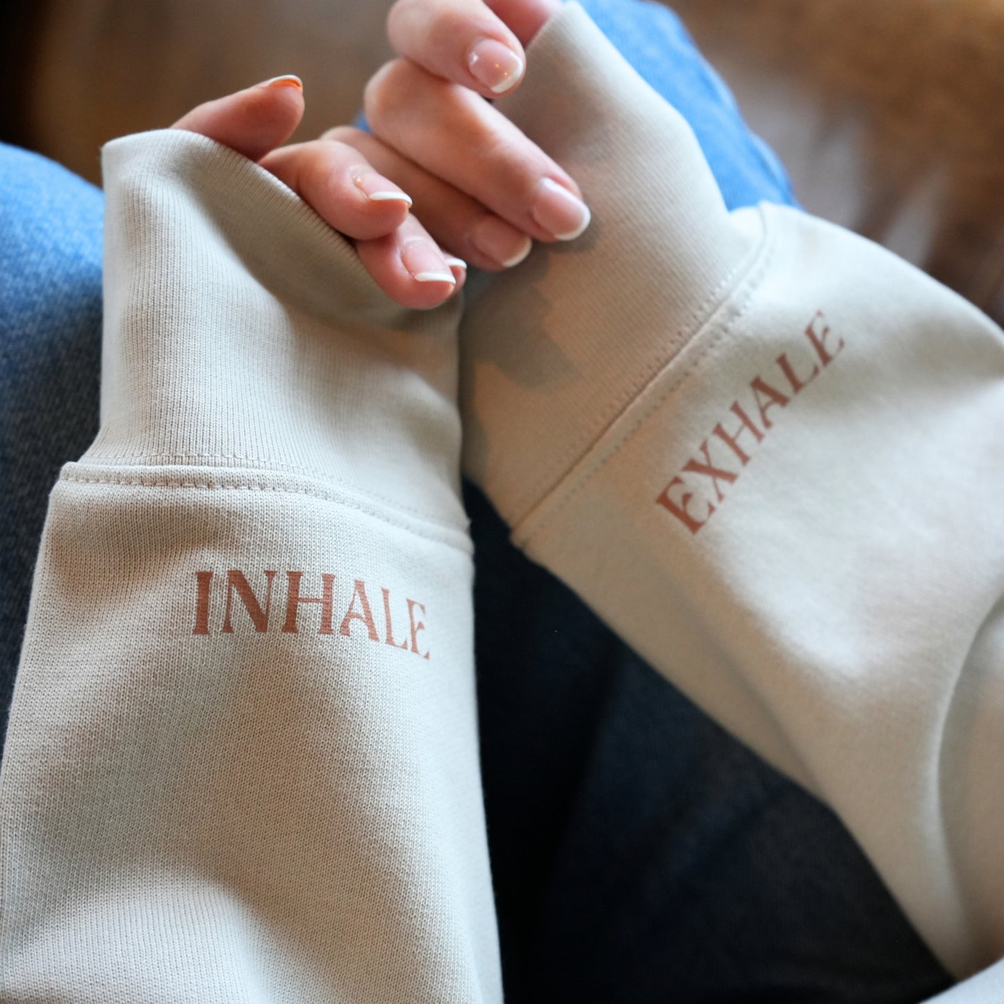 Close-up of Sand Colour sleeves with 'INHALE' and 'EXHALE' text by Every Little Thread