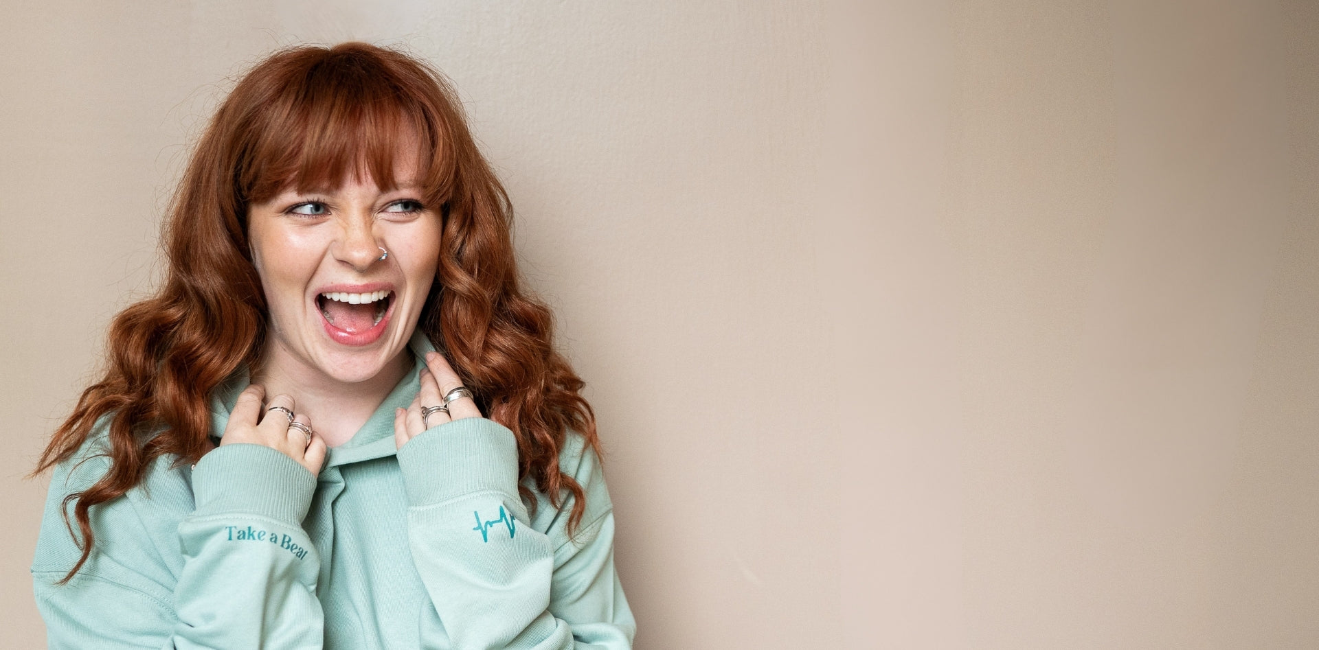 Girl wearing a hoodie in Aloe colour by Every Little Thread
