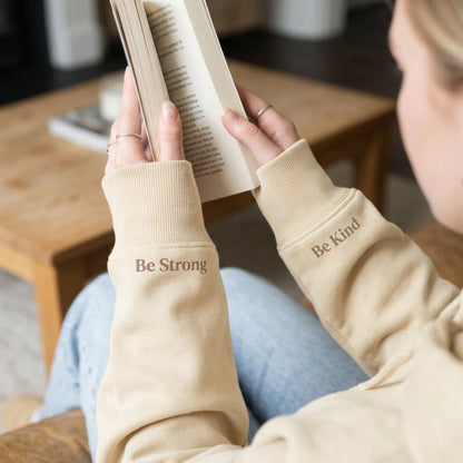 Close-up of Honey Colour sleeves with 'Be Strong' and 'Be Kind' text by Every Little Thread