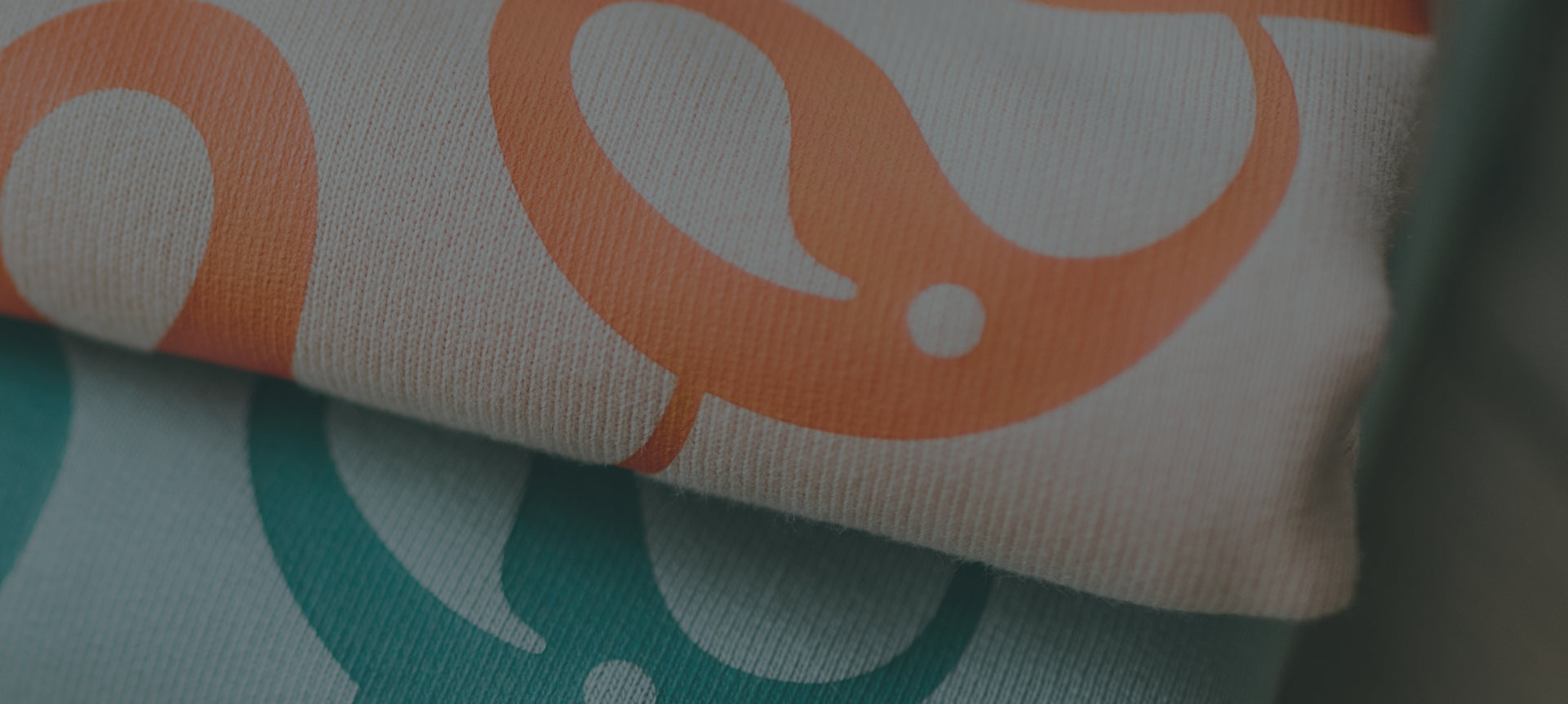 Close-up of Every Little Thread logo design on sweatshirts 