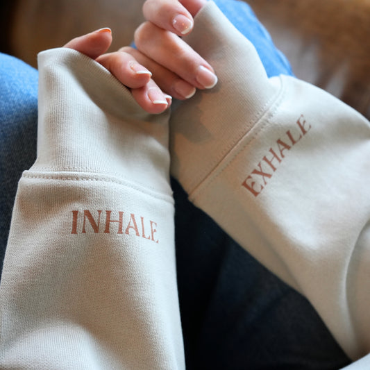 Close-up of Sand Colour sleeves with 'INHALE' and 'EXHALE' text by Every Little Thread