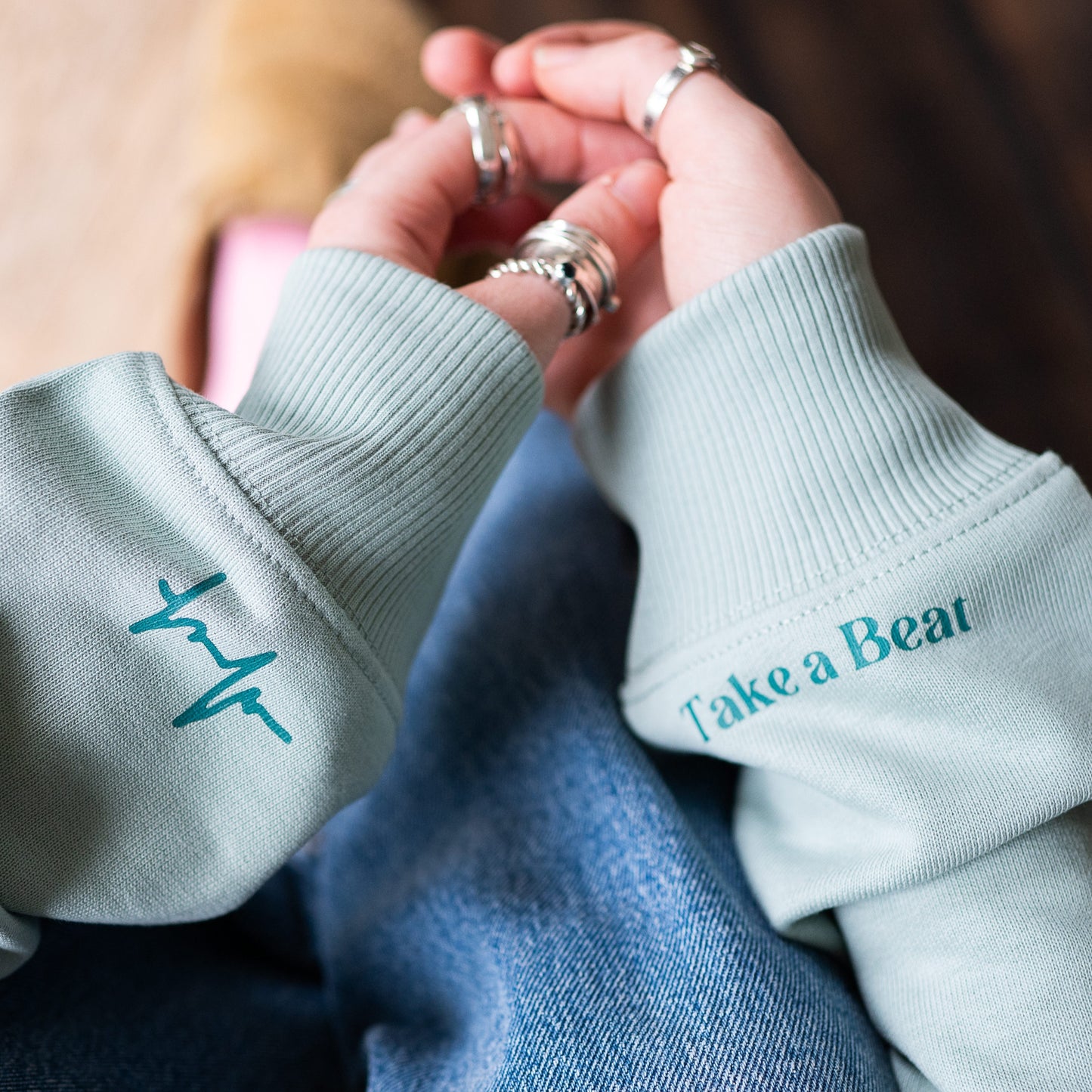 Close-up of Take A Beat sleeve in Aloe colour by Every Little Thread