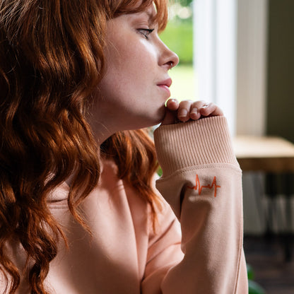 Girl wearing a Peach Hoodie by Every Little Thread