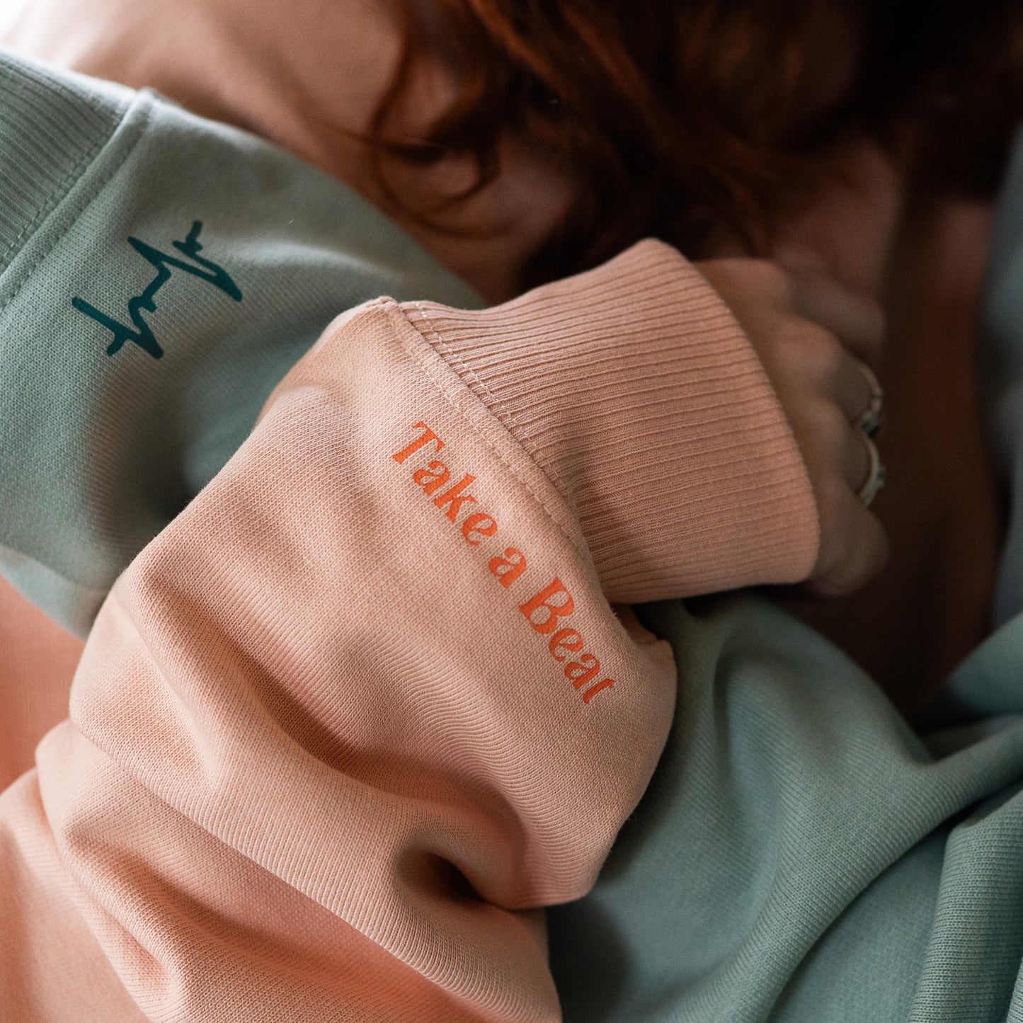 Close-up of Take A Beat Sleeves in Peach and Aloe colour by Every Little Thread